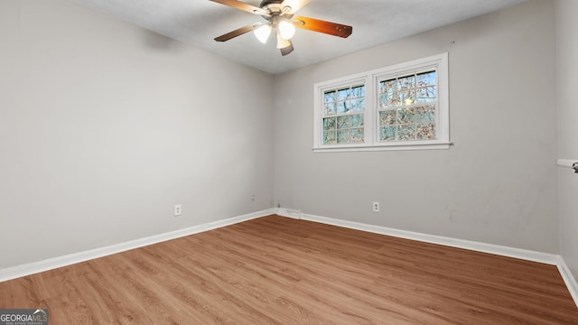 empty room featuring ceiling fan and light hardwood / wood-style flooring