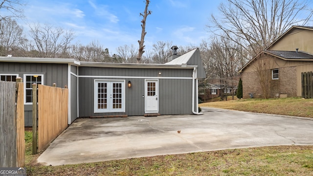 exterior space with a yard and french doors