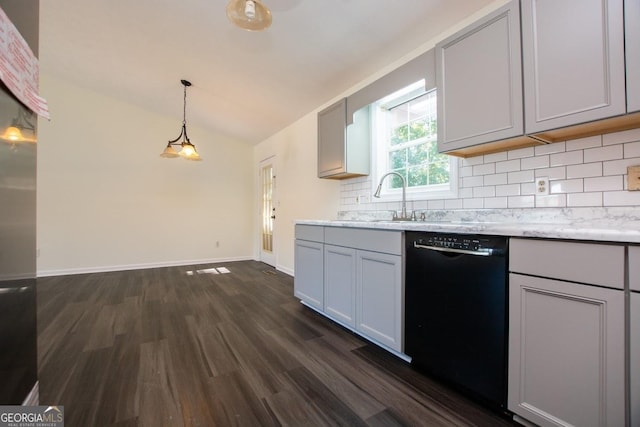 kitchen with dishwasher, sink, hanging light fixtures, dark hardwood / wood-style flooring, and vaulted ceiling