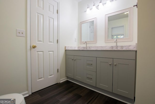 bathroom featuring vanity and hardwood / wood-style flooring