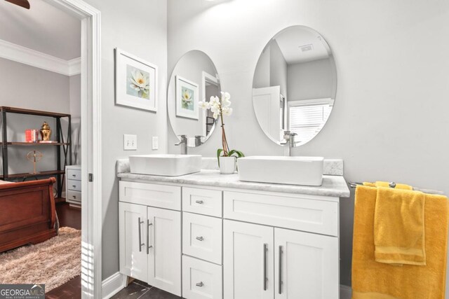 bathroom featuring vanity and ornamental molding