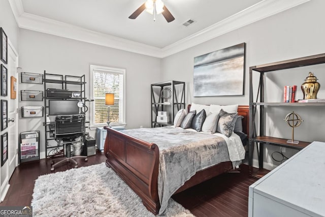 bedroom featuring ceiling fan, crown molding, and dark wood-type flooring