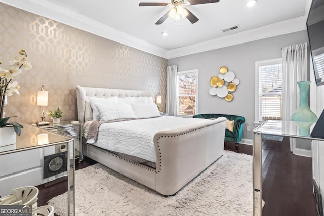 bedroom with ceiling fan, crown molding, and hardwood / wood-style flooring