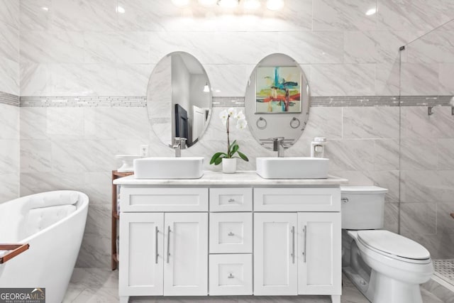 full bathroom featuring shower with separate bathtub, vanity, toilet, and tile walls