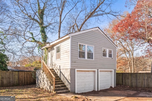 view of property exterior with a garage