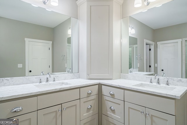full bath with double vanity and a sink