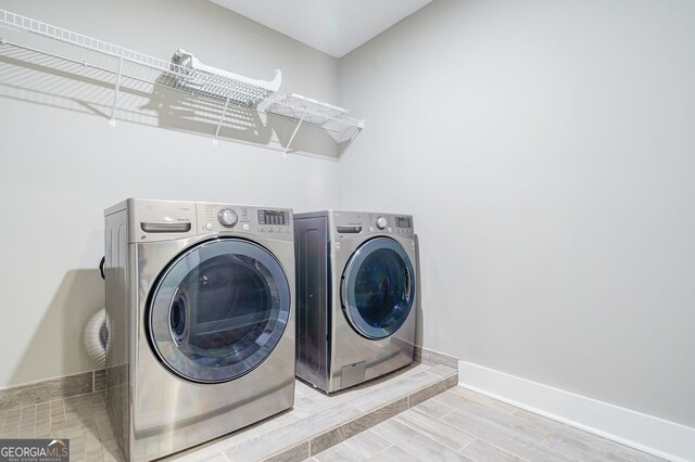 laundry room featuring washer and clothes dryer