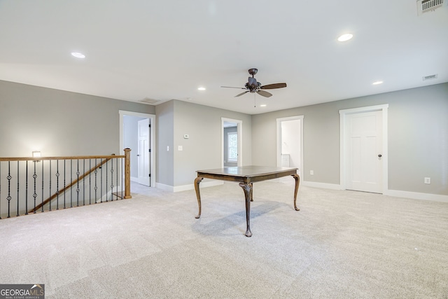 interior space with visible vents, recessed lighting, a ceiling fan, and light carpet