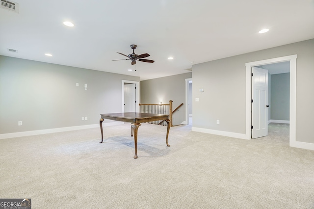 rec room with light carpet and ceiling fan