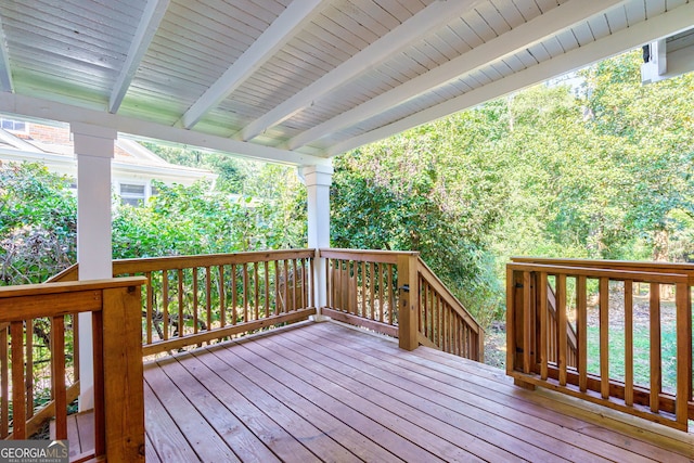 wooden deck with a water view