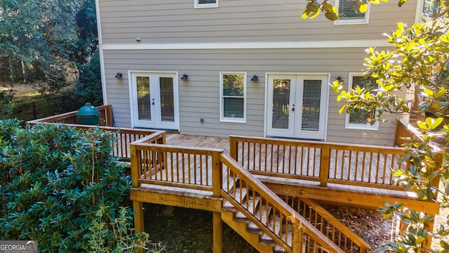 wooden terrace with french doors and stairway