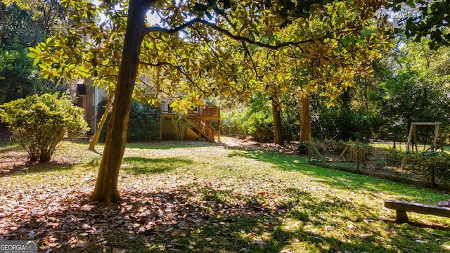 view of yard featuring a wooden deck