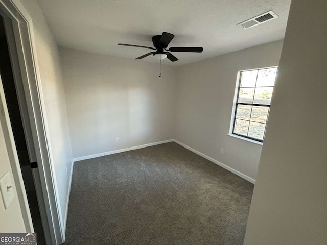 carpeted empty room with ceiling fan