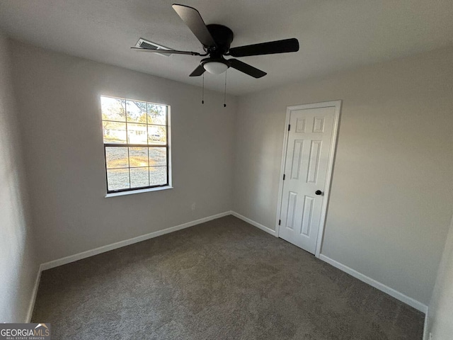 carpeted empty room with ceiling fan