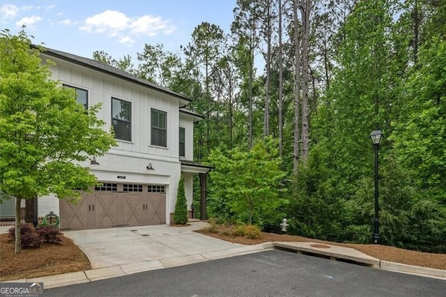 view of side of home featuring a garage