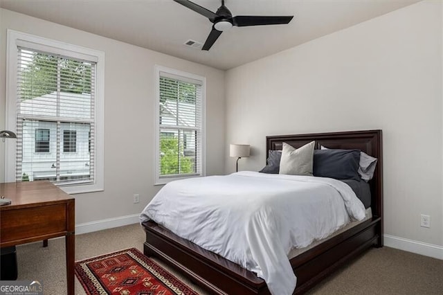 carpeted bedroom with ceiling fan