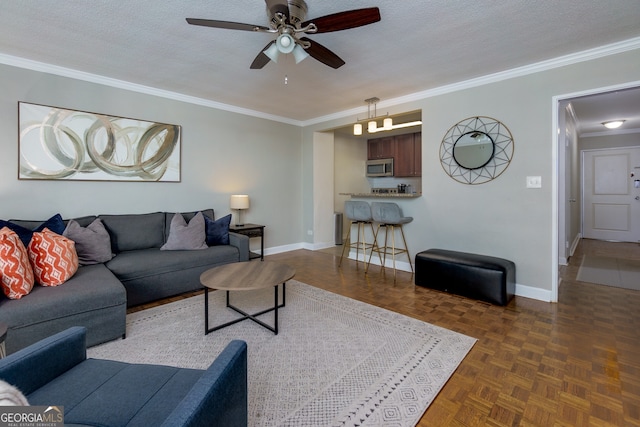 living room with dark parquet flooring, a textured ceiling, and ceiling fan