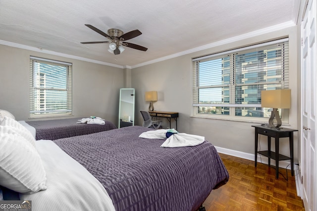 bedroom with dark parquet flooring, ceiling fan, a textured ceiling, and ornamental molding