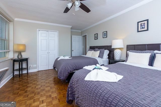 bedroom with dark parquet floors, ceiling fan, ornamental molding, a textured ceiling, and a closet