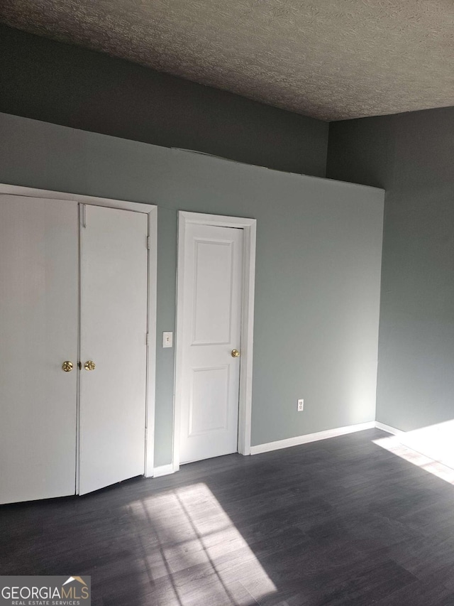 unfurnished bedroom with a textured ceiling