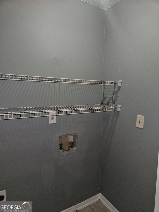 washroom featuring tile patterned floors, electric dryer hookup, and hookup for a washing machine