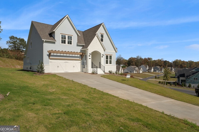 view of property with a front lawn and a garage