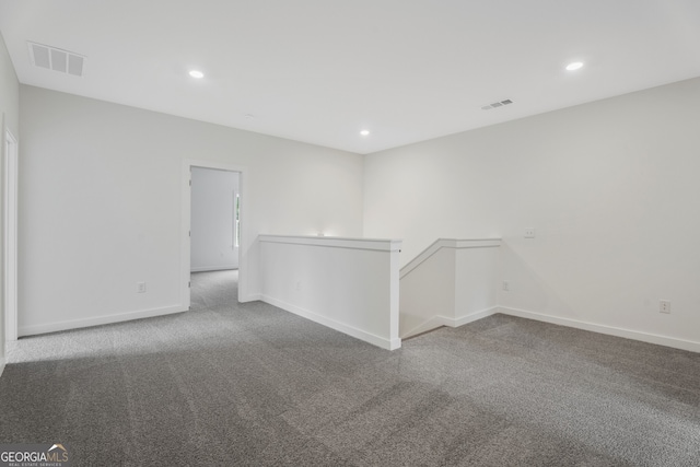 unfurnished room featuring carpet flooring