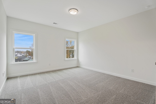 unfurnished room featuring carpet floors