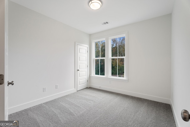 empty room featuring carpet floors