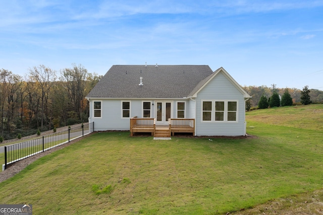 back of house with a lawn and a wooden deck