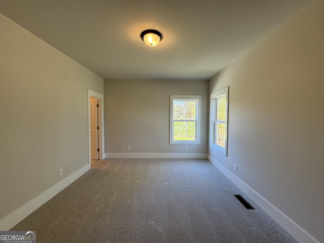 view of carpeted spare room