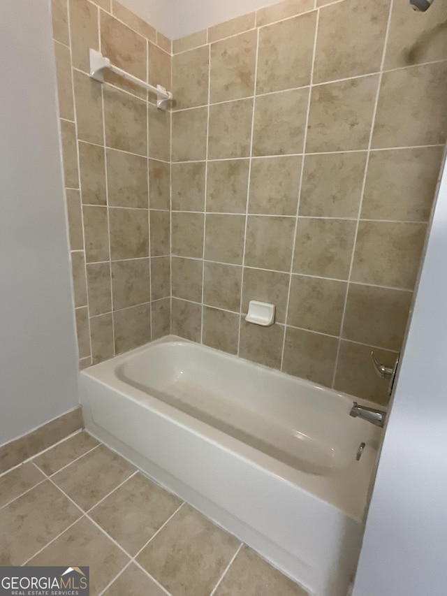 bathroom featuring tile patterned flooring and tiled shower / bath combo