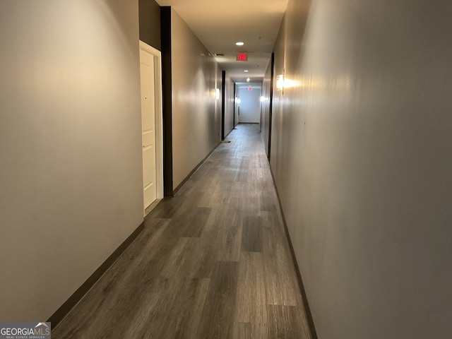 corridor with dark wood-type flooring