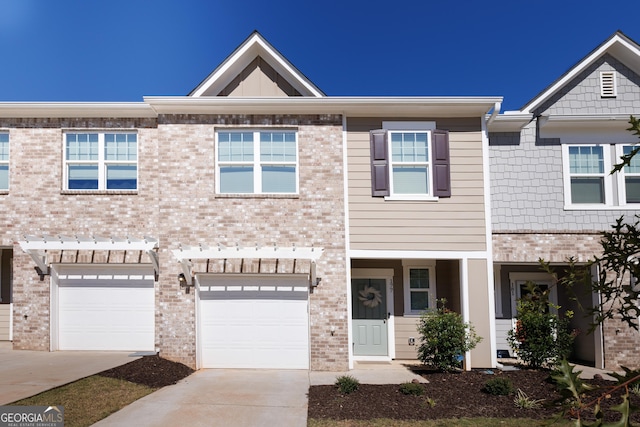 multi unit property featuring a garage