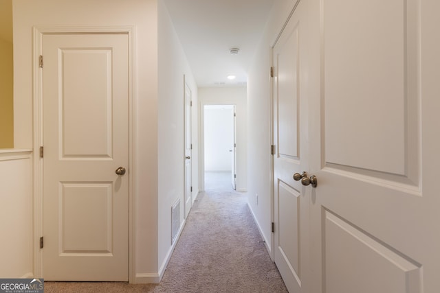 corridor with light carpet