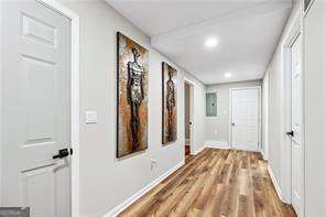 hall with hardwood / wood-style flooring