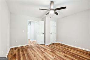 unfurnished bedroom with hardwood / wood-style flooring and ceiling fan