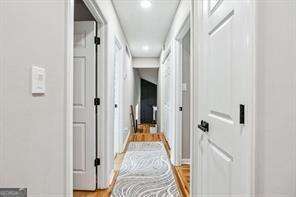 hallway featuring hardwood / wood-style floors