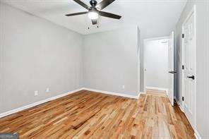 unfurnished room with hardwood / wood-style floors