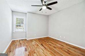 spare room with wood-type flooring