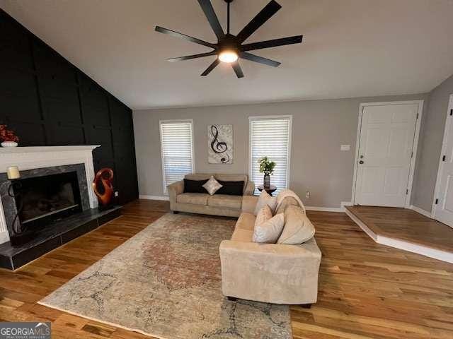 living room with hardwood / wood-style floors and ceiling fan