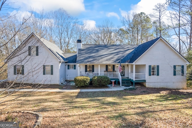 view of front of home featuring a front yard and covered porch