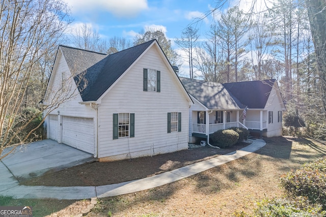 view of front of home featuring covered porch and a garage