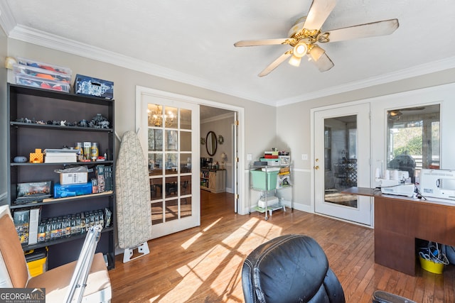 interior space with hardwood / wood-style floors, crown molding, and french doors