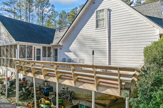 back of property featuring a sunroom