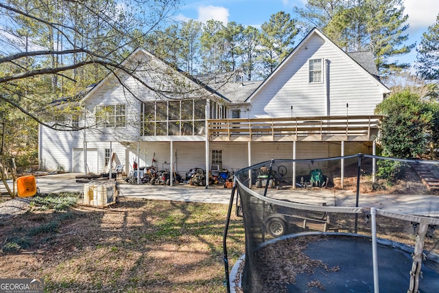 back of property featuring a sunroom