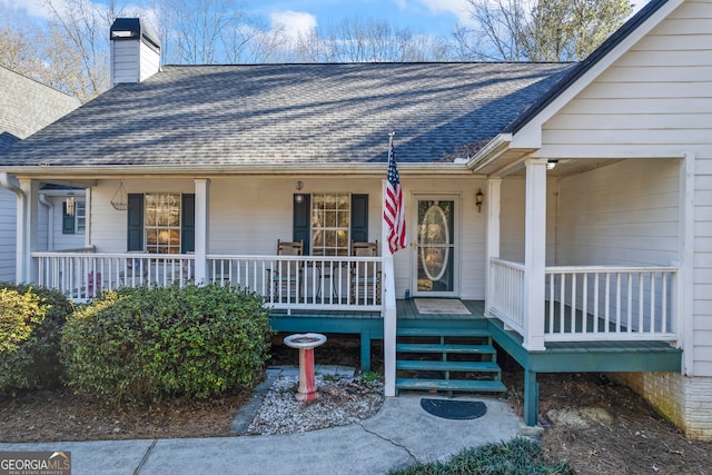 doorway to property featuring covered porch