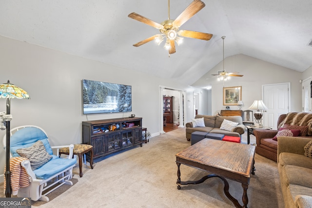 living room featuring ceiling fan, light colored carpet, and vaulted ceiling