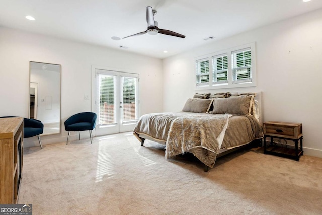 carpeted bedroom featuring access to exterior, french doors, and ceiling fan