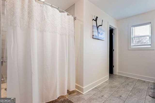 bathroom featuring walk in shower